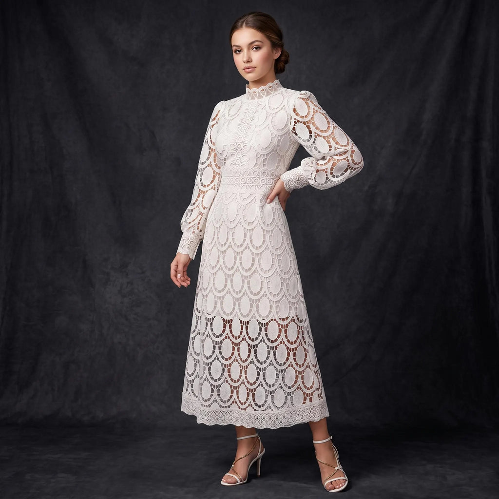 A woman models a long-sleeved lace midi dress in off-white, featuring an intricate circular lace pattern and a high mock neck, posed against a dark textured studio backdrop.