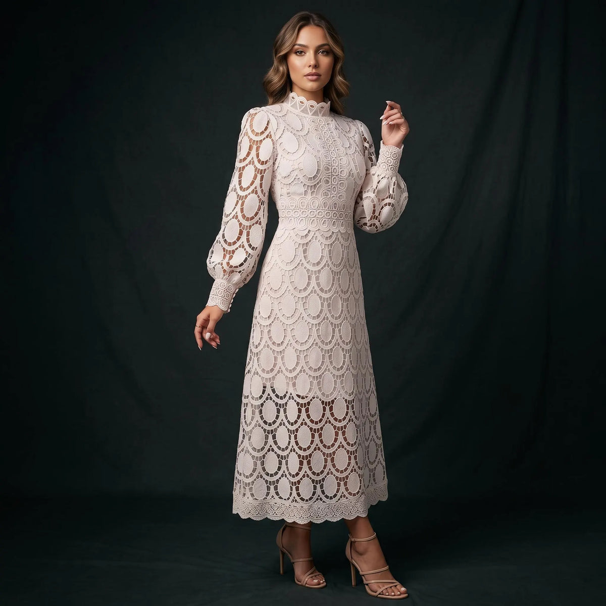 A woman modeling a high-neck, long-sleeve lace midi dress in cream or off-white, standing against a dark studio backdrop. The dress features an intricate floral lace pattern with scalloped edges and sheer sections.