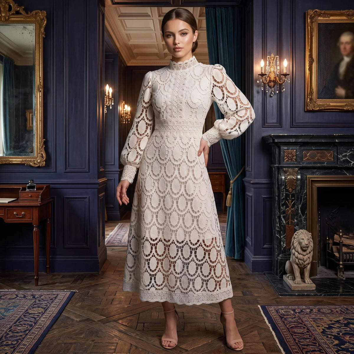A woman stands in an ornate dark blue room wearing a cream lace midi dress with long puff sleeves, a high mock neck, and a fitted bodice. The dress features an intricate repeating lace pattern and is shown in a luxurious interior setting with a fireplace, mirrors, and patterned rugs.